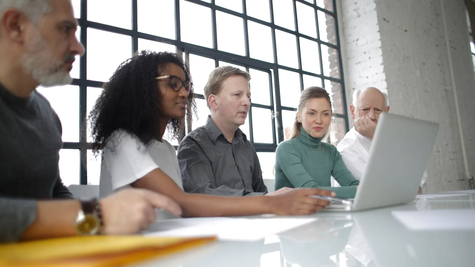 What Is Cognosys? 7 Important Facts About the AI Workflow Agent 29 What is Cognosys limited by represented by a business team reviewing work on a laptop