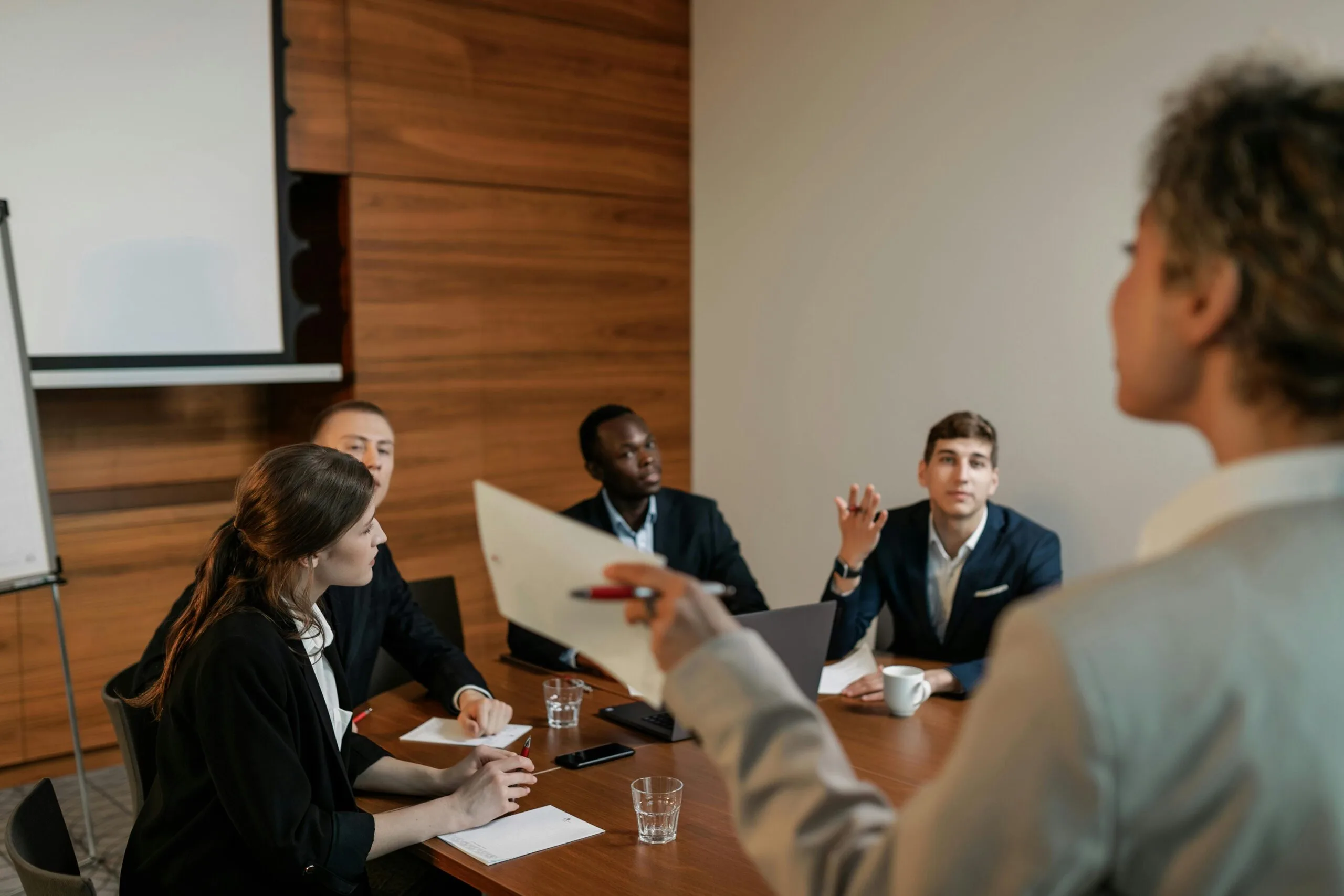 What Is Lenix? 7 Powerful Facts About the AI Sales Engine 26 A sales team discussion representing where what is Lenix works best for follow-through and warmer leads