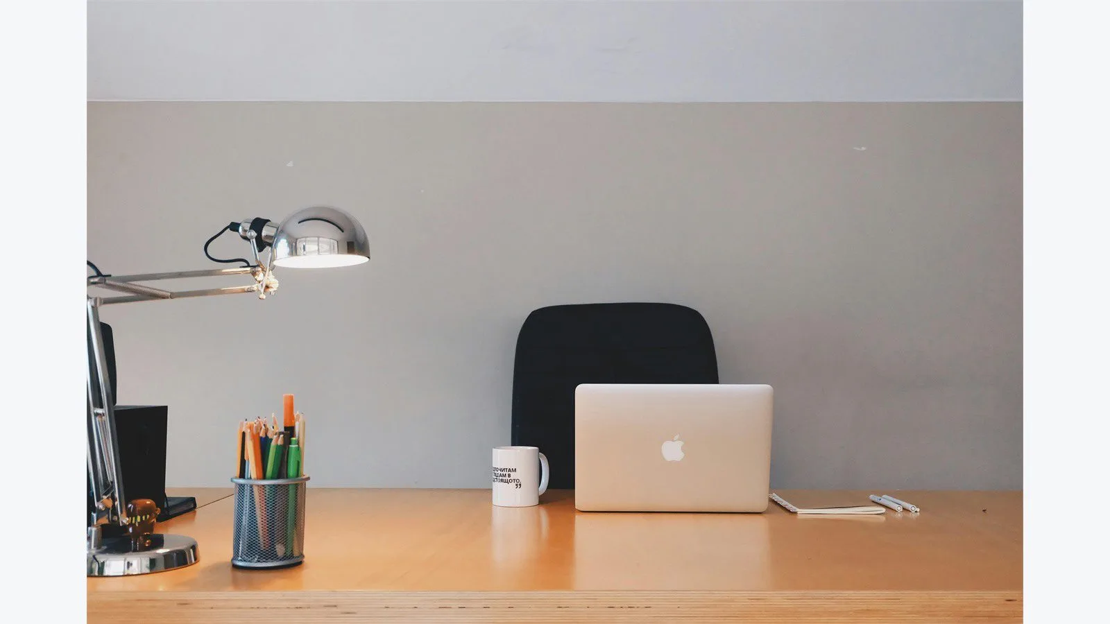 What Is Adobe FrameMaker? 7 Essential Facts for Beginners 10 Technical documentation desk with laptop, lamp, and writing tools