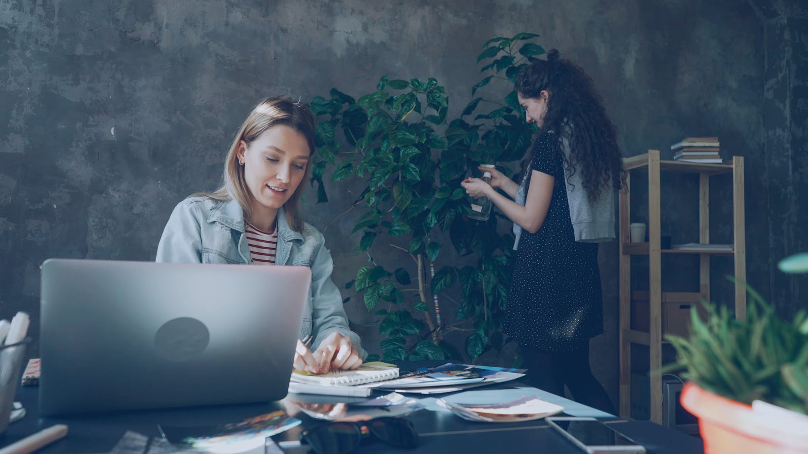 AIOps ROI for Helpdesks: 7 Powerful SMB Payback Wins 23 Small business team working on laptops after improving helpdesk operations