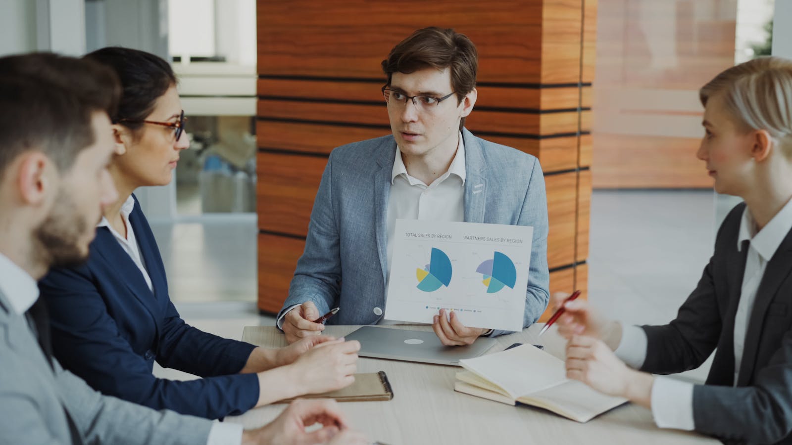 AIOps ROI for Helpdesks: 7 Powerful SMB Payback Wins 20 Business team reviewing charts for a 90 day AIOps helpdesk pilot
