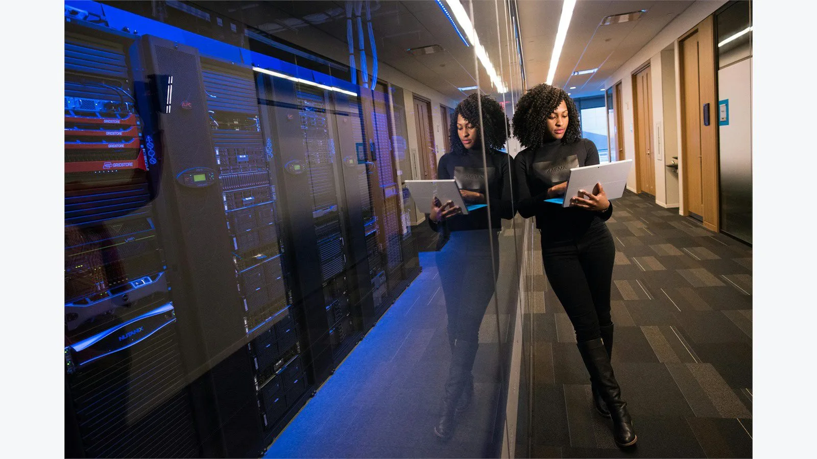 AngularJS End of Life in 2026: 7 Smart Moves for Legacy Apps 13 IT professional using a laptop in a data center while managing ongoing support coverage