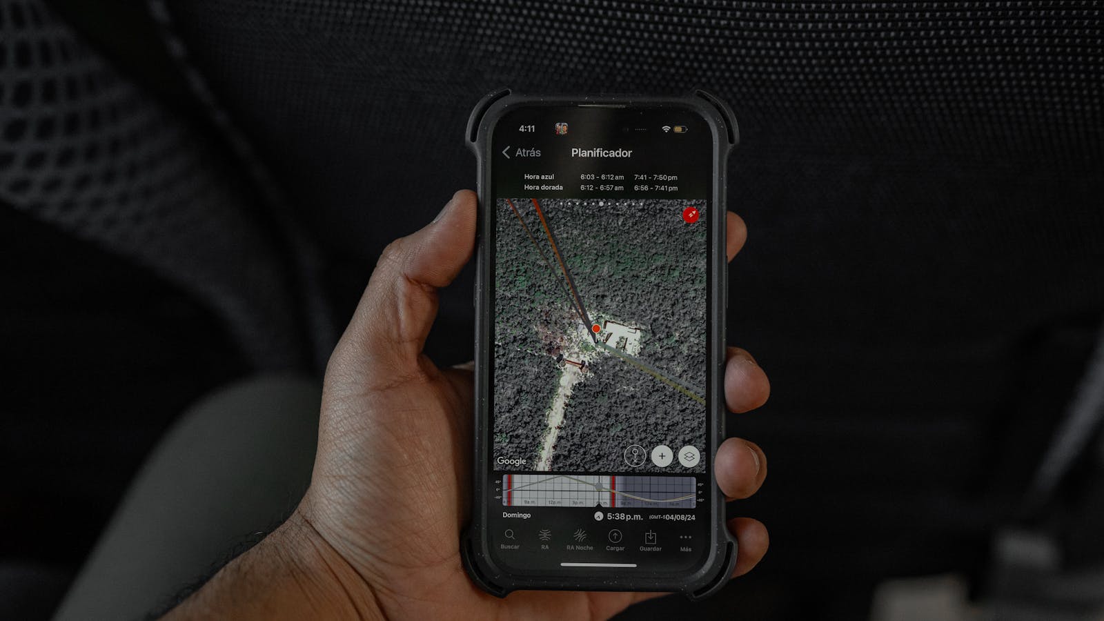 Ask Maps AI navigation on a smartphone with a GPS route in a car