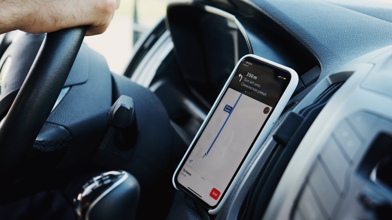 Ask Maps: 7 Powerful Ways Gemini Makes Travel Smarter 17 Ask Maps and Immersive Navigation shown through a smartphone route on a car dashboard