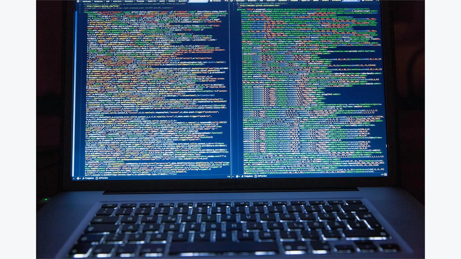 Asynchronous programming in Java workspace with dual coding screens and a coffee mug beside a laptop