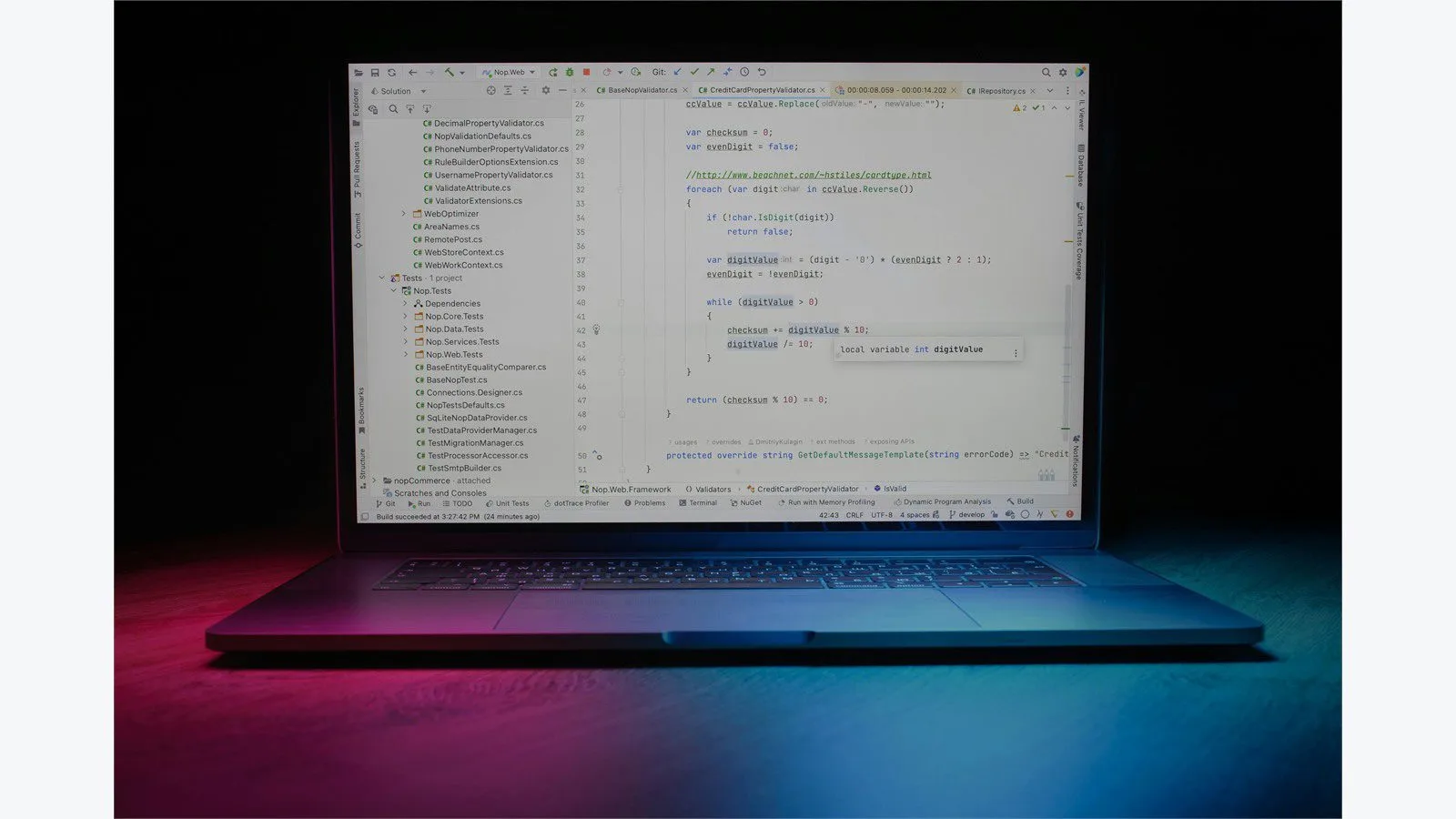 Asynchronous programming in Java shown on a laptop screen with colorful code in a workspace