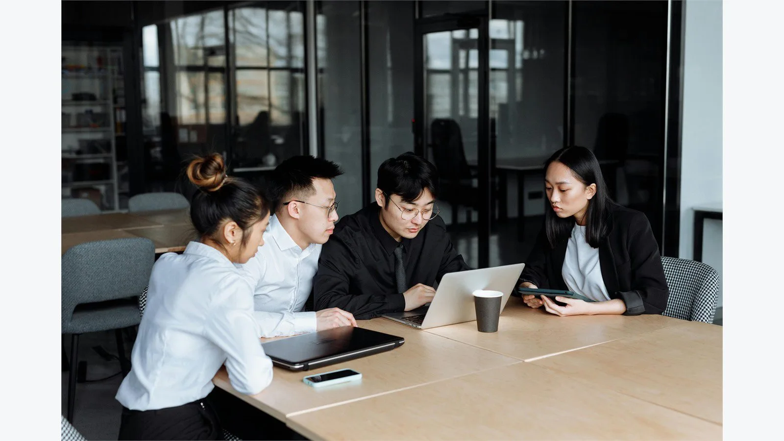Netflix VOID AI: 7 bold changes for video editing 16 Netflix VOID AI business impact concept with a video team reviewing a laptop