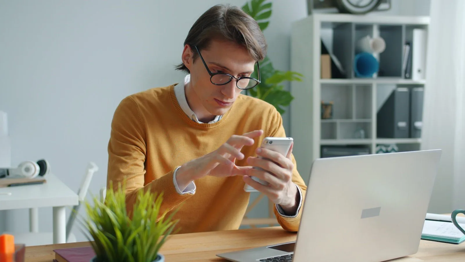 Noscroll AI: 7 smart ways to beat doomscrolling 17 Noscroll AI FAQ concept with a professional reviewing phone information at a work desk