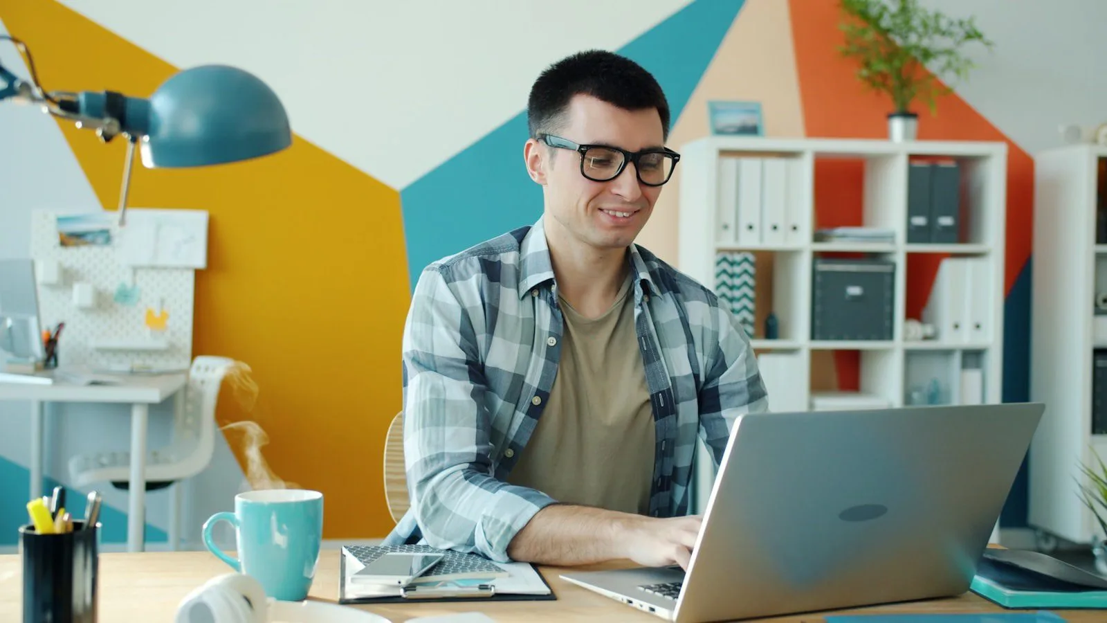 Noscroll AI: 7 smart ways to beat doomscrolling 15 Noscroll AI work use case concept with a professional focused on a laptop in a colorful office