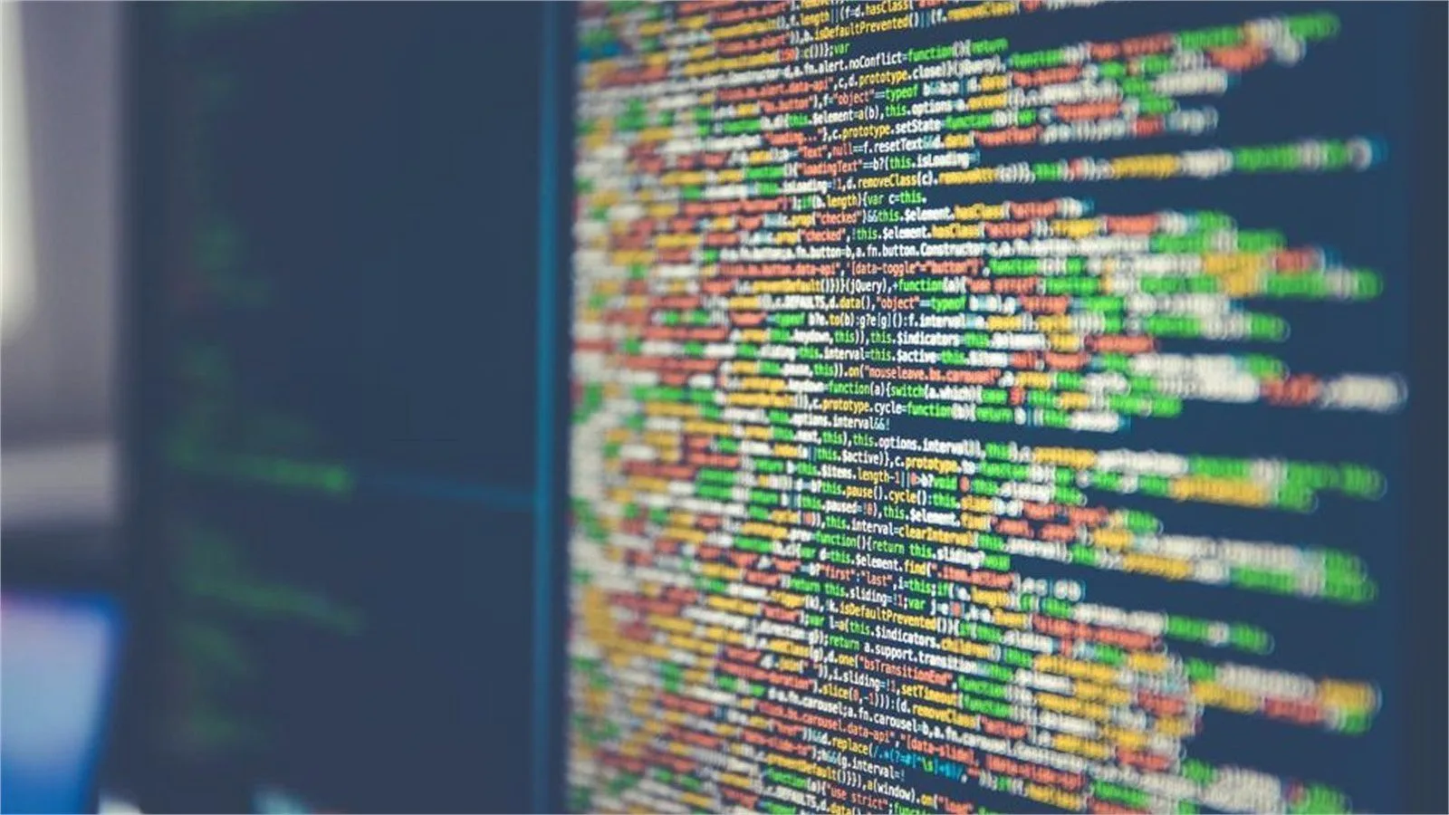 Code editor on a monitor representing technical questions about OpenAI Infosys AI tools