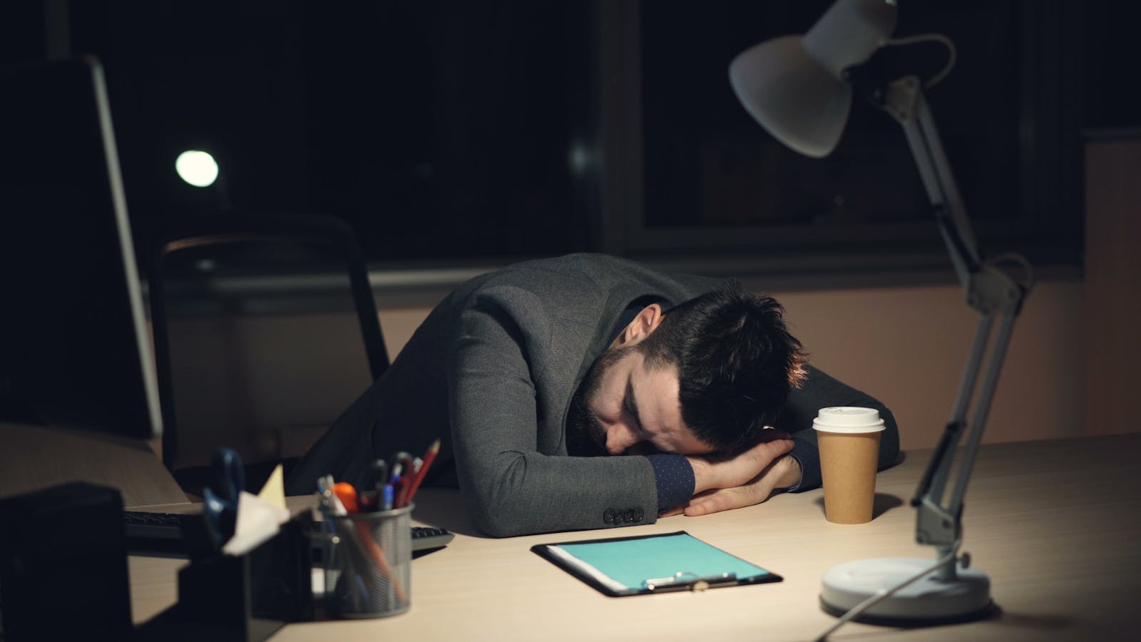 Predictive Self-Healing: 7 Powerful AIOps Fixes for IT 13 exhausted worker at night showing why predictive self-healing reduces 3 AM outages