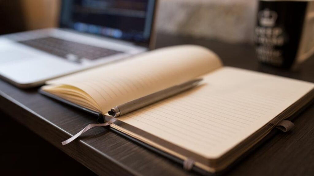 Voxtral TTS notebook and pen representing a 30-day voice AI review plan